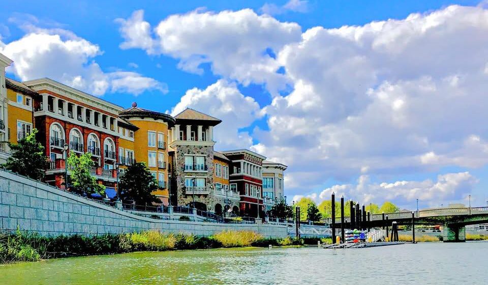 A beautiful day on the Napa waterfront looking back at downtown from a boat on the water.